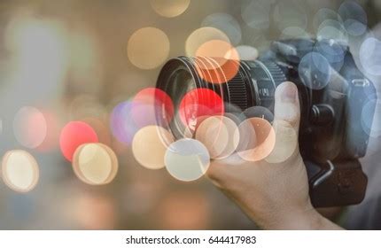 Hand Holding Dslr Camera Bokeh Double Stock Photo 644417983 | Shutterstock