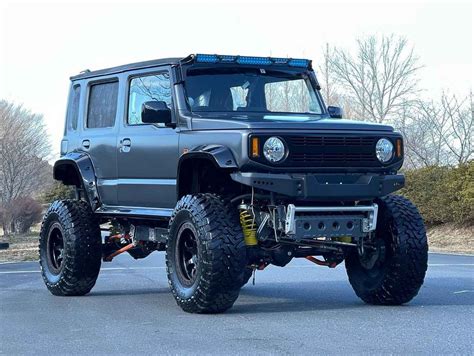 5-Door Suzuki Jimny With Lift Kit Debuts With 122 HP & Huge Wheels