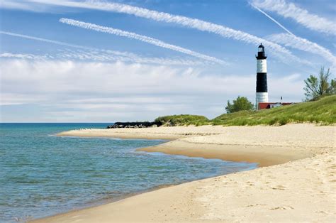 Lighthouse And Beach In Summer With by Catnap72