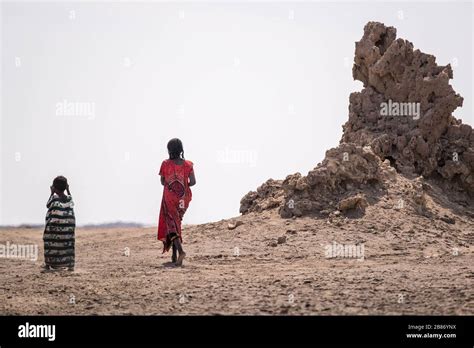 Africa, Djibouti, Lake Abbe. Landscape view of lake Abbe Two children ...