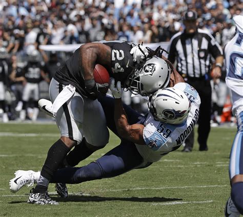 Marshawn Lynch goes full Beast Mode as he runs over 305-pound Titans tackle