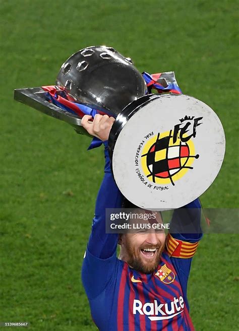 Barcelona's Argentinian forward Lionel Messi raises La Liga trophy as ...