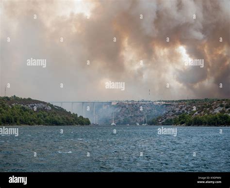 Forest fire in Croatia, summer natural disaster close to national park Krka, Sibenik region ...