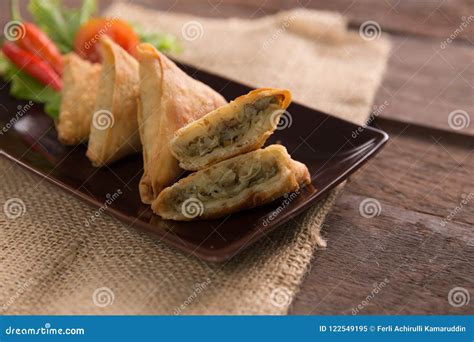 Samosa or sambusa stock image. Image of lettuce, onions - 122549195