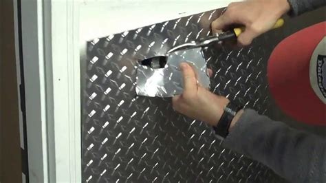 Part 1 - Installing aluminum diamond plate wall panels in garage, how to cut around an outlet ...