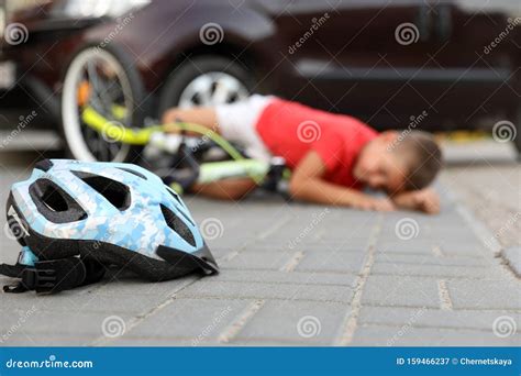 Little Boy Fallen from Bicycle after Car Accident, Focus on Helmet Stock Image - Image of ...