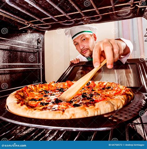 Chef Cooking Pizza in the Oven. Stock Photo - Image of cook, ingredient: 64756572