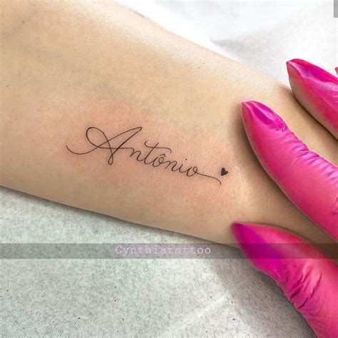 a woman's arm with the word antonio written in cursive writing on it