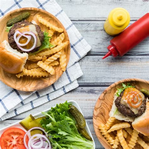 Cheeseburger Sliders with Fries and a Platter of Toppings Stock Image ...