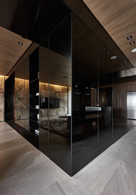 Black Acrylic, Glass and Stone Form This Dark and Sophisticated Apartment Interior