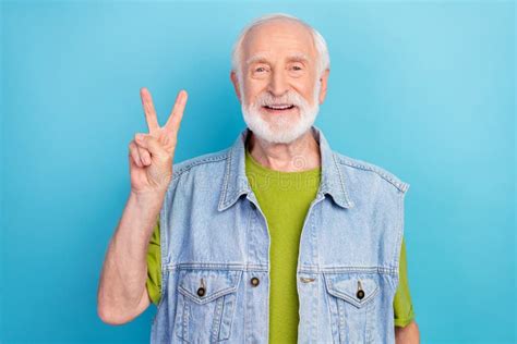 Photo of Funky Cute Retired Man Wear Vintage Jeans Waistcoat Showing V-sign Smiling Isolated ...