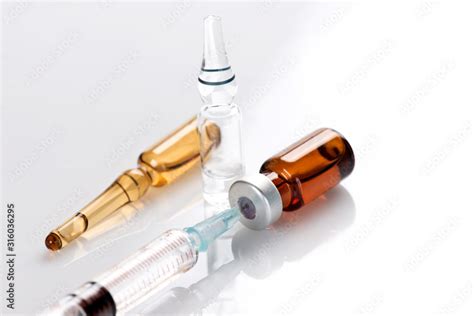 Amber Vial and Ampule With Syringe Stock Photo | Adobe Stock