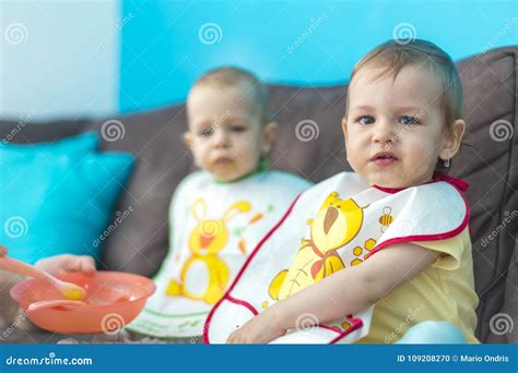 Feeding little baby twins stock photo. Image of child - 109208270