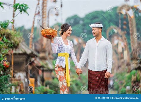 Balinese Couple Wearing Traditional Clothes Walking Together in Bali ...