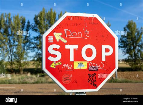 Graffiti-covered stop sign Stock Photo - Alamy