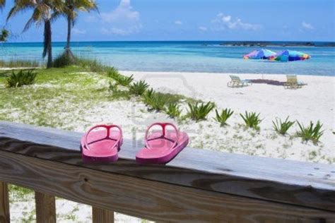 Pink Flip flops on the deck of a Caribbean beach resort. Beach.. | Caribbean beach resort ...