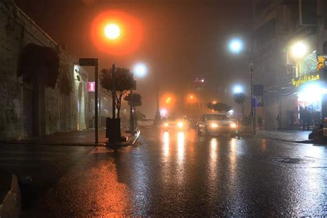 RAMALLAH - A foggy night in Ramallah, Main Street, facing Al-Manarah ...