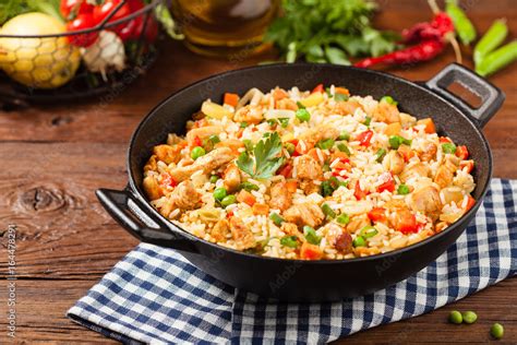 Fried rice with chicken. Prepared and served in a wok. Stock Photo ...