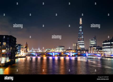 Southwark Bridge and London skyline at night Stock Photo - Alamy