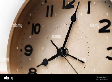 vintage white alarm clock closeup Stock Photo - Alamy