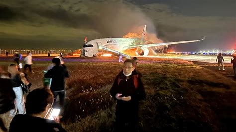 Japan plane fire: Family 'still in shock' after evacuating burning aircraft | World News | Sky News