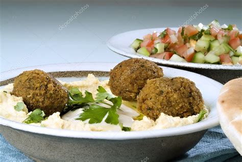 Hummus falafel and arabic salad — Stock Photo © NoamArmonn #1340970