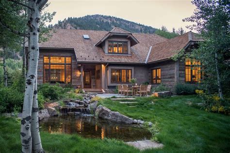 Great use of cabin styling, wood and overgrown grass as a feature, not neglect | Rustic exterior ...