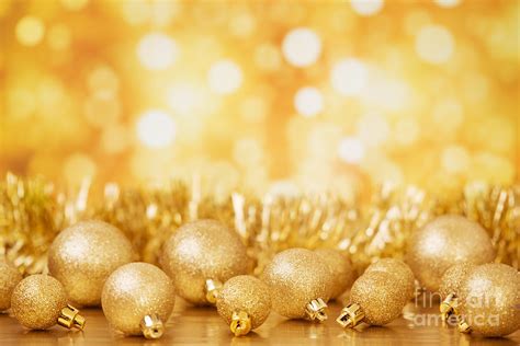 Christmas scene with gold baubles, gold background Photograph by Sara ...