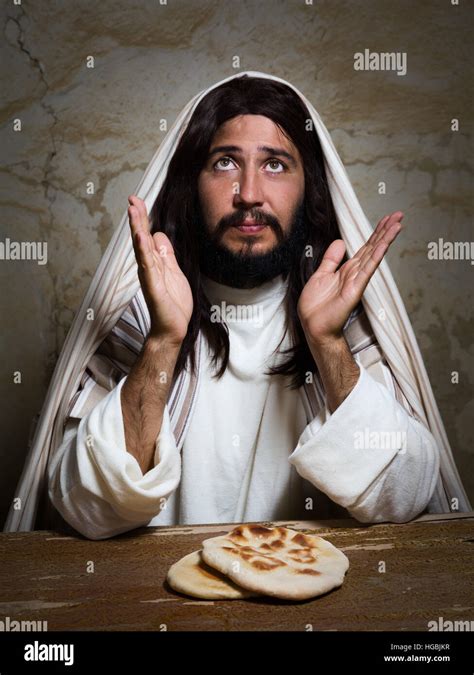 Jesus hands breaking bread hi-res stock photography and images - Alamy