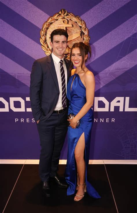 Fremantle Dockers players, coaches and partners hit the purple carpet ...