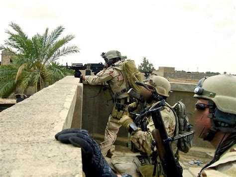 SEAL Team 3 Delta platoon on a roof overlook during the 2006 Battle of Ramadi in Iraq. [17871340 ...