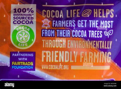 100% sustainably sources cocoa cocoalife information on packet of Cadbury Dairy Milk Orange ...