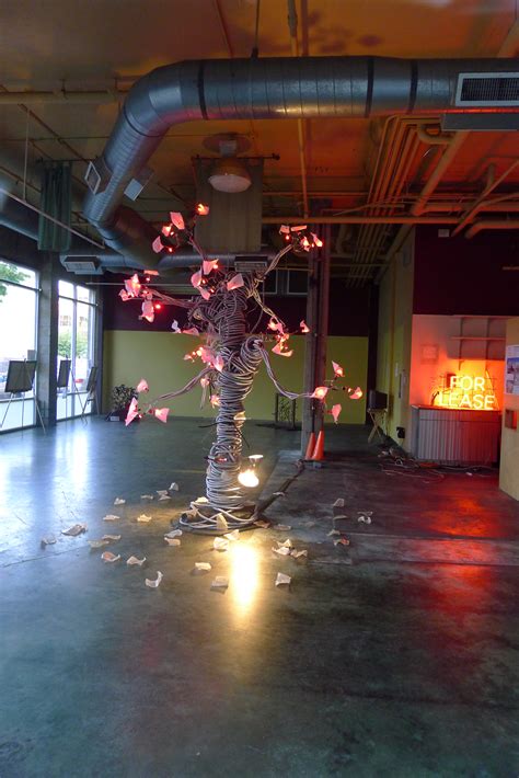 Lit tree art installation in vacant space | The Unscripted Mind