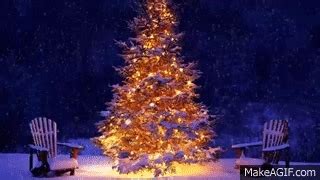 Snowing Christmas tree and Christmas music on Make a GIF