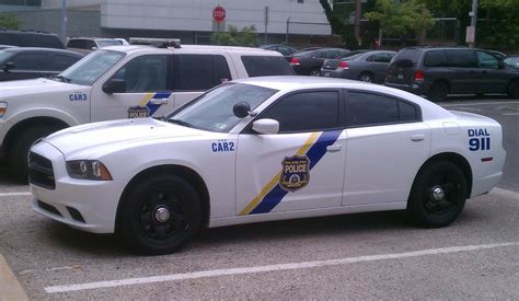 two police cars parked next to each other in a parking lot