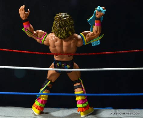 Ultimate Warrior Hall of Fame figure -holding belt | Lyles Movie Files