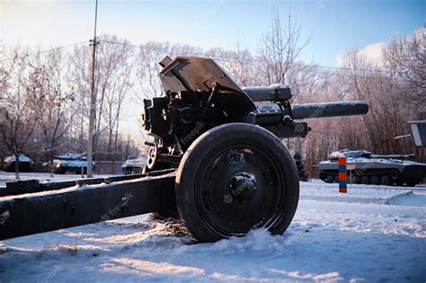 Premium Photo | Tank under the snow in the forest winter tank ...