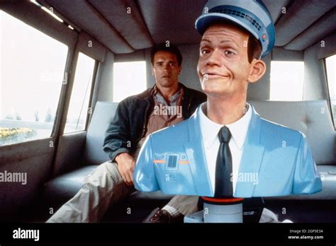 TOTAL RECALL, from left: Arnold Schwarzenegger, Johnny Cab driver (voice: Robert Picardo), 1990 ...