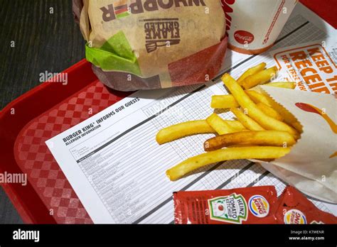 allergen information sheet on a tray with a burger king meal Stock Photo - Alamy