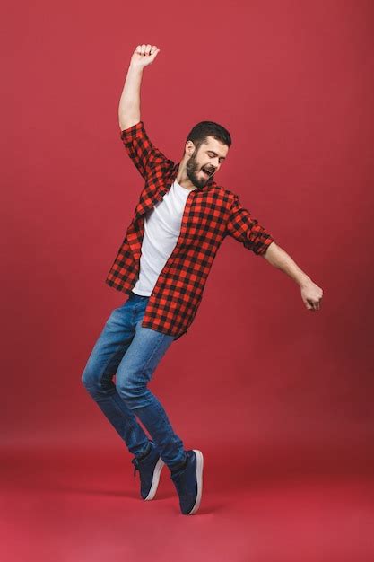 Premium Photo | Full length portrait of an excited young man jumping