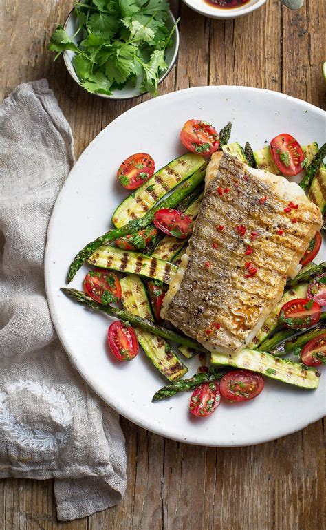 Grilled soy and lime hake recipe with charred greens, fresh tomato & a chili dressing + ways to ...