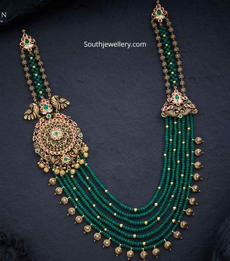 Emerald beads necklace with peacock side pendant - Indian Jewellery Designs