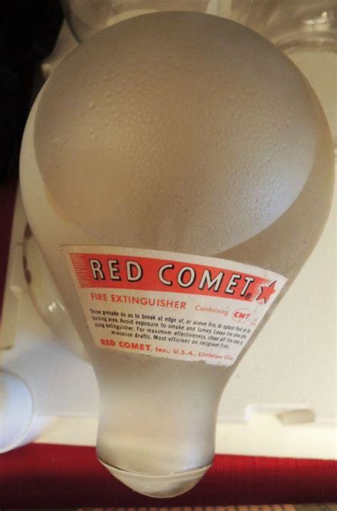 Antique RED COMET Fire Extinguisher - Clear - w Box | EstateSales.org