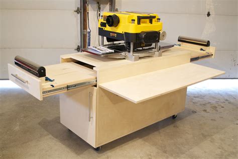 A custom planer bench I designed and built the out feed tables support up to 150lbs. and offer ...