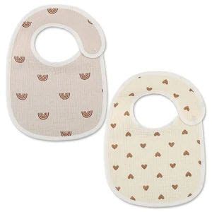 two bibs with hearts on them sitting next to each other