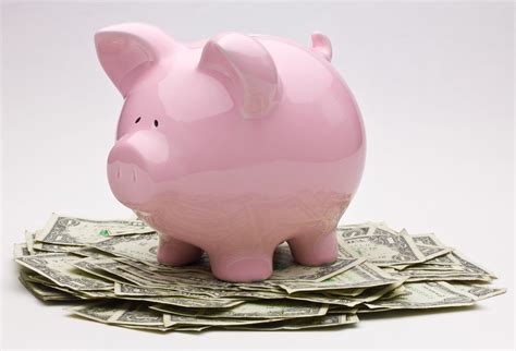 Pink Piggy Bank On Top Of A Pile Of One Dollar Bills | Flickr