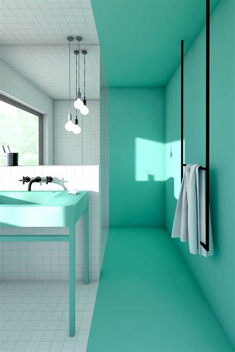 a bathroom with green walls and white tile flooring, along with a blue ...