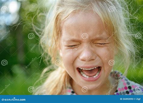 Sad little girl crying stock image. Image of pouring - 34492093