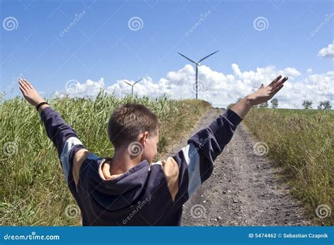 Boy and wind turbine stock photo. Image of mill, country - 5474462