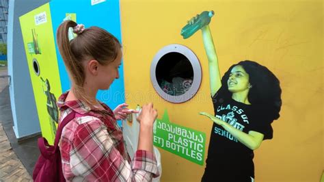 Woman is Throwing Plastic Bottles into the Yellow Recycling Trash Bin Container Stock Video ...